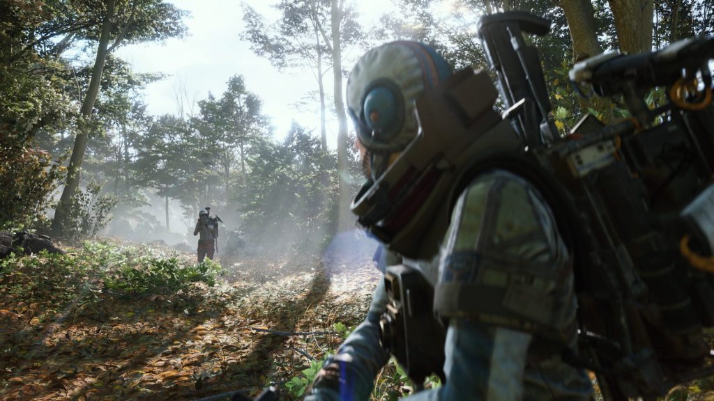 Squad of players battling drones in a ruined desert landscape in ARC Raiders" title="ARC Raiders - team combat in open world